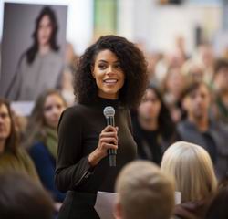 woman speaking at a marketing success event